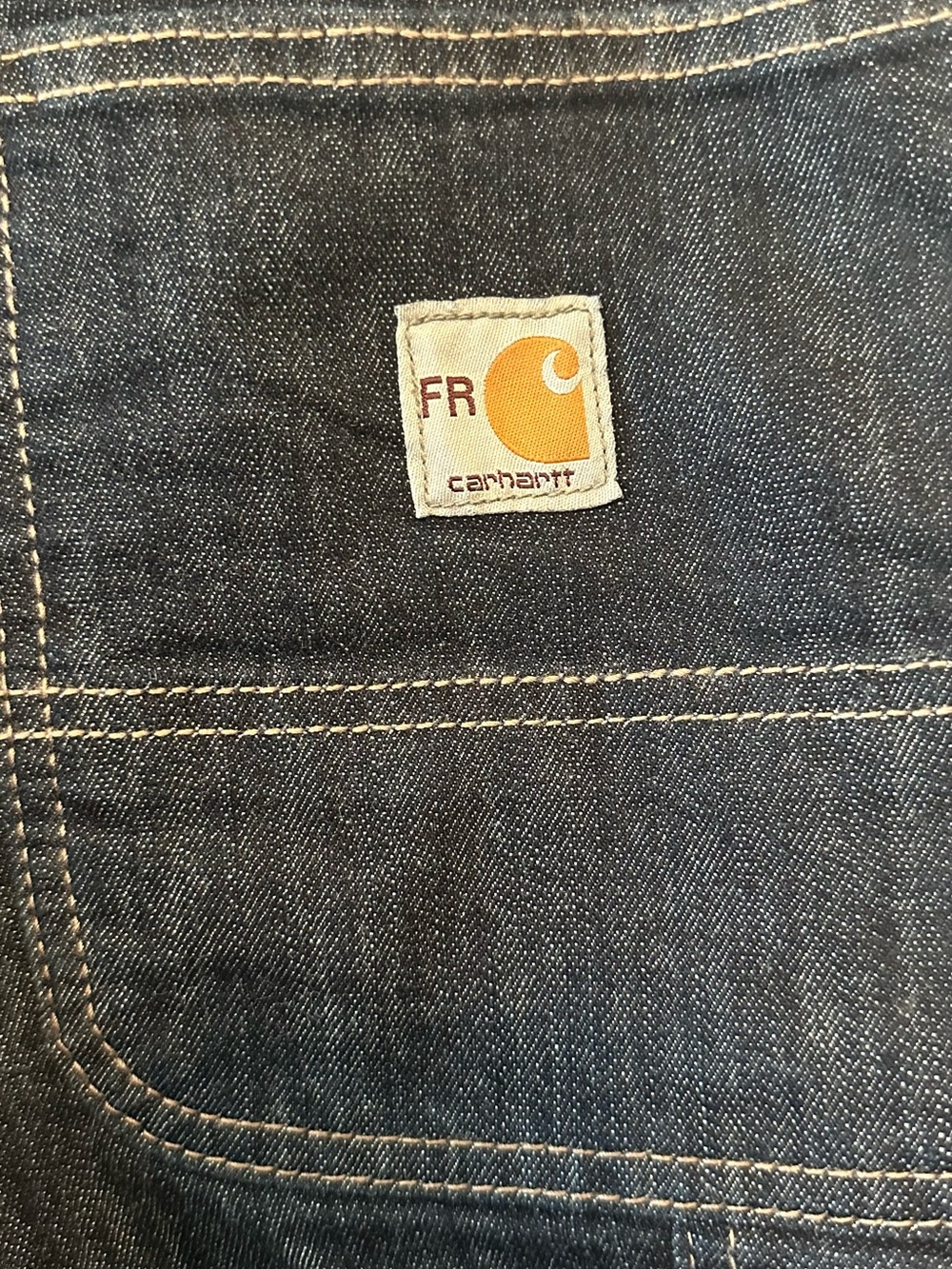 Carhartt flame-resis work jeans w/CAT 2 safety rating and NFPA 2112 compliance